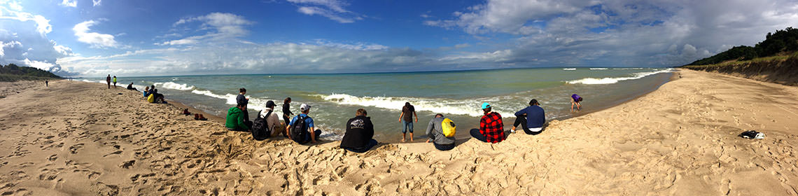 Students at the shores of Lake Michigan
