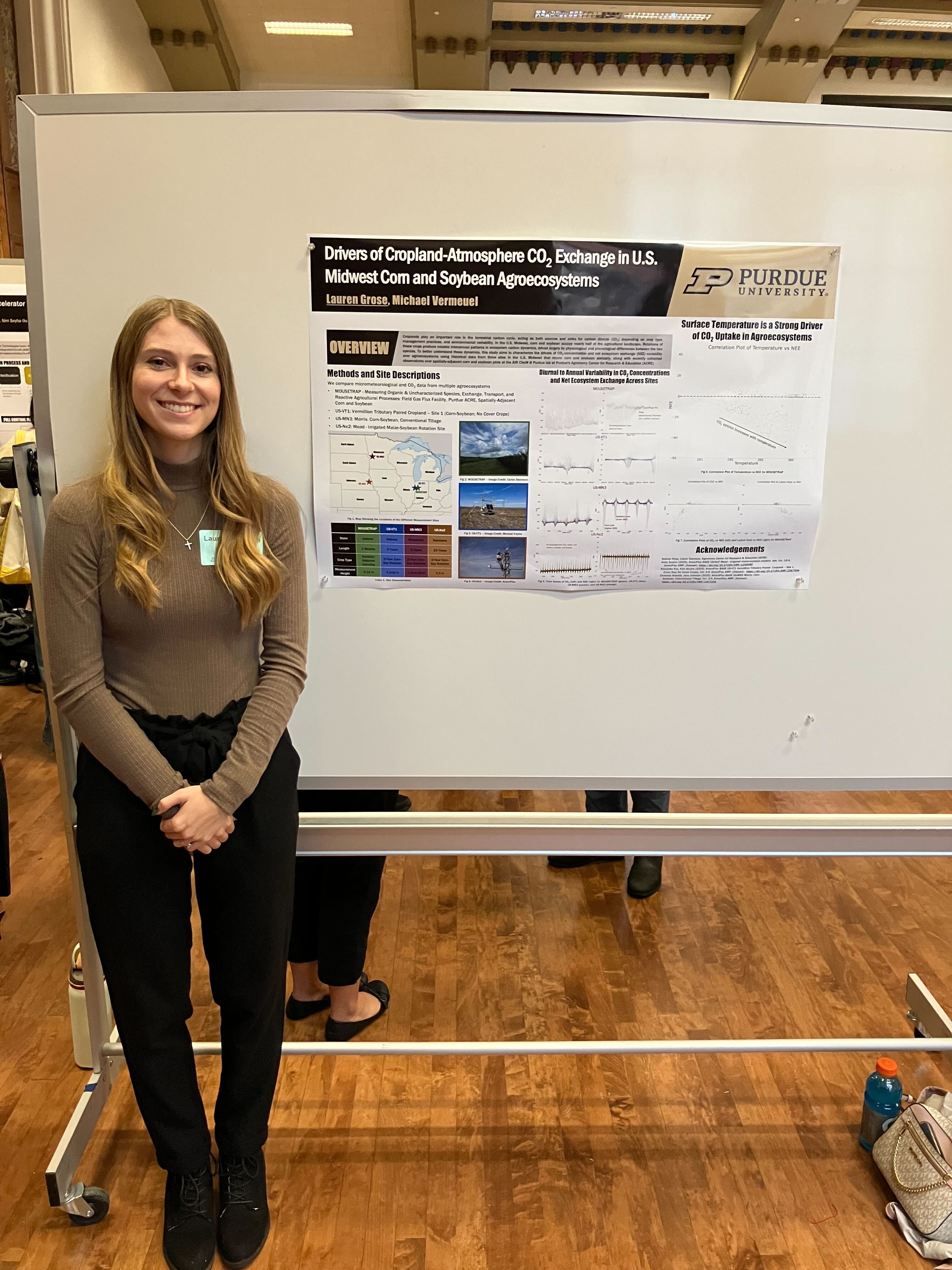 Lauren presenting her poster at the undergraduate expo