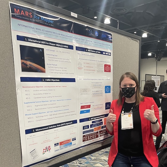 Ali Bramson helping with the International Mars Ice Mapper Measurement Definition Team poster at LPSC 2022