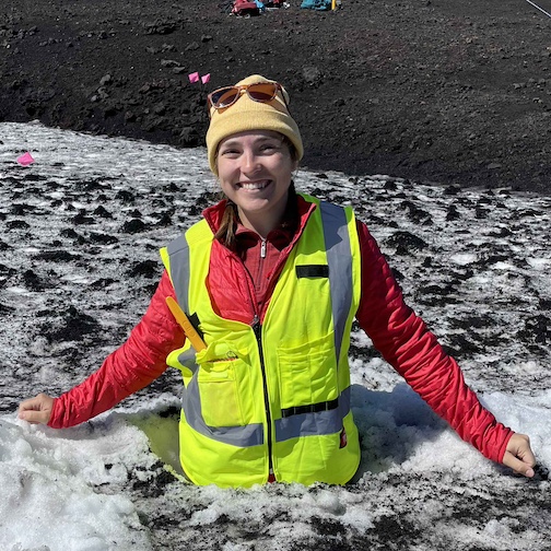 Riley standing in a hole we dug in the snowpack during field work