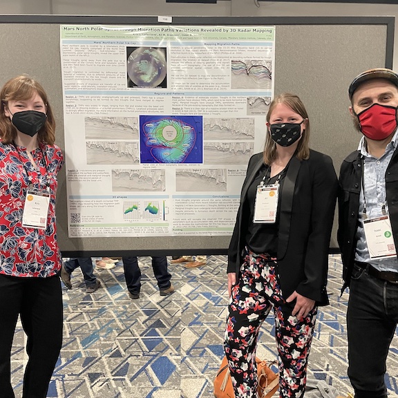 Kris Laferriere with colleagues at poster at LPSC2022