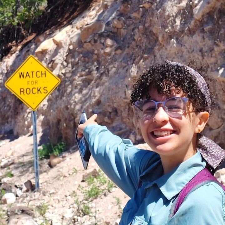 Santa with sign saying Watch for Rocks during the GeoSPACE accessible field course program