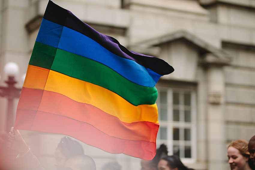 Students holding the pride flag.