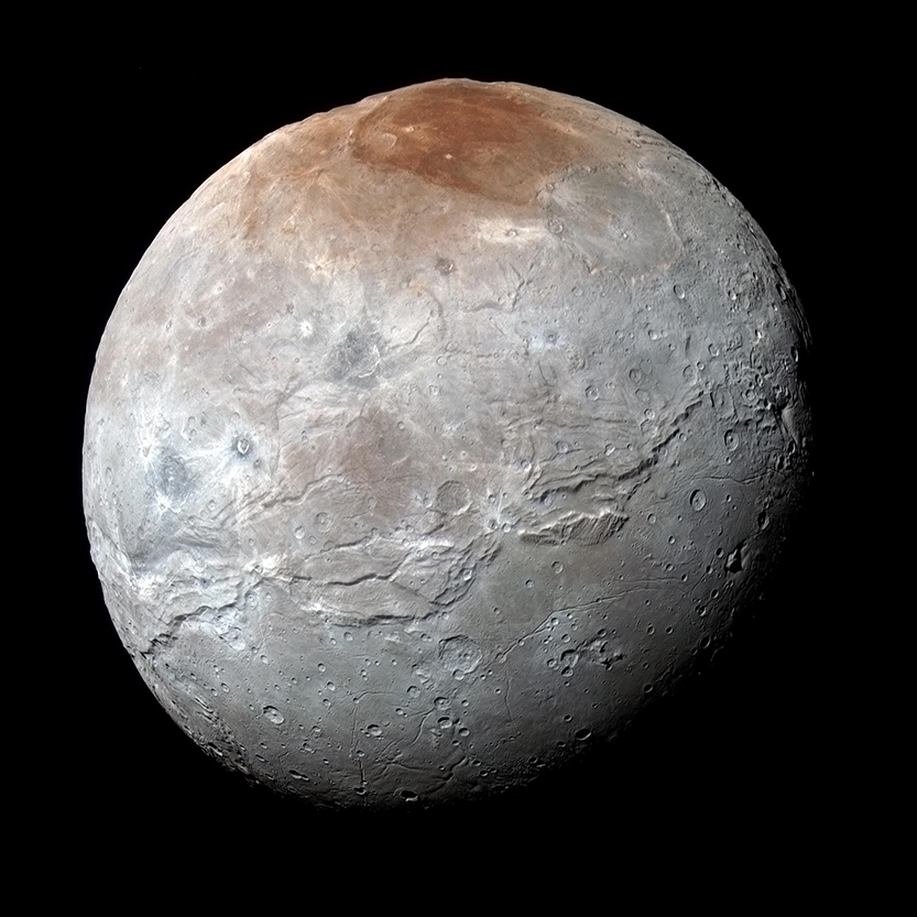 Charon, Pluto’s largest moon, has a red spot at the polar cap.