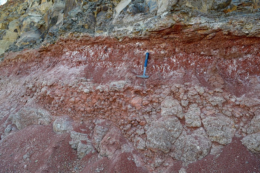 Paleosol (red bole) between two basalt flows within the Deccan Traps.