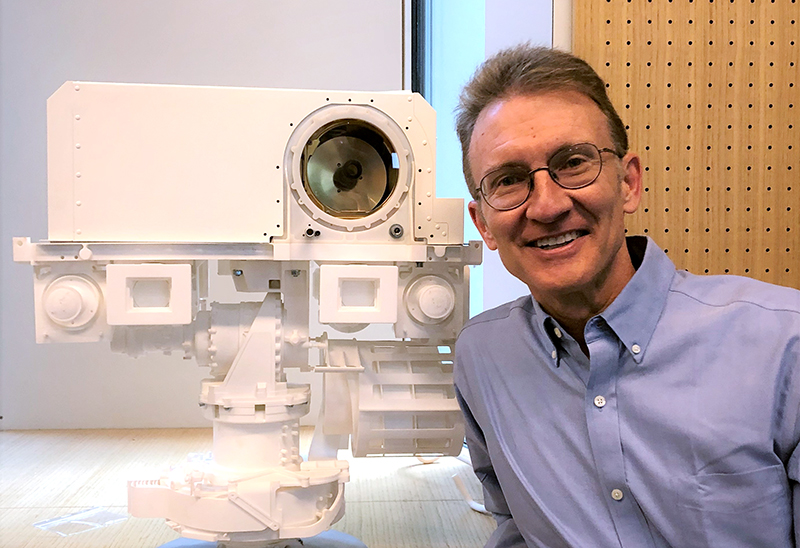 Roger Wiens with the mast of the Perseverance Rover.